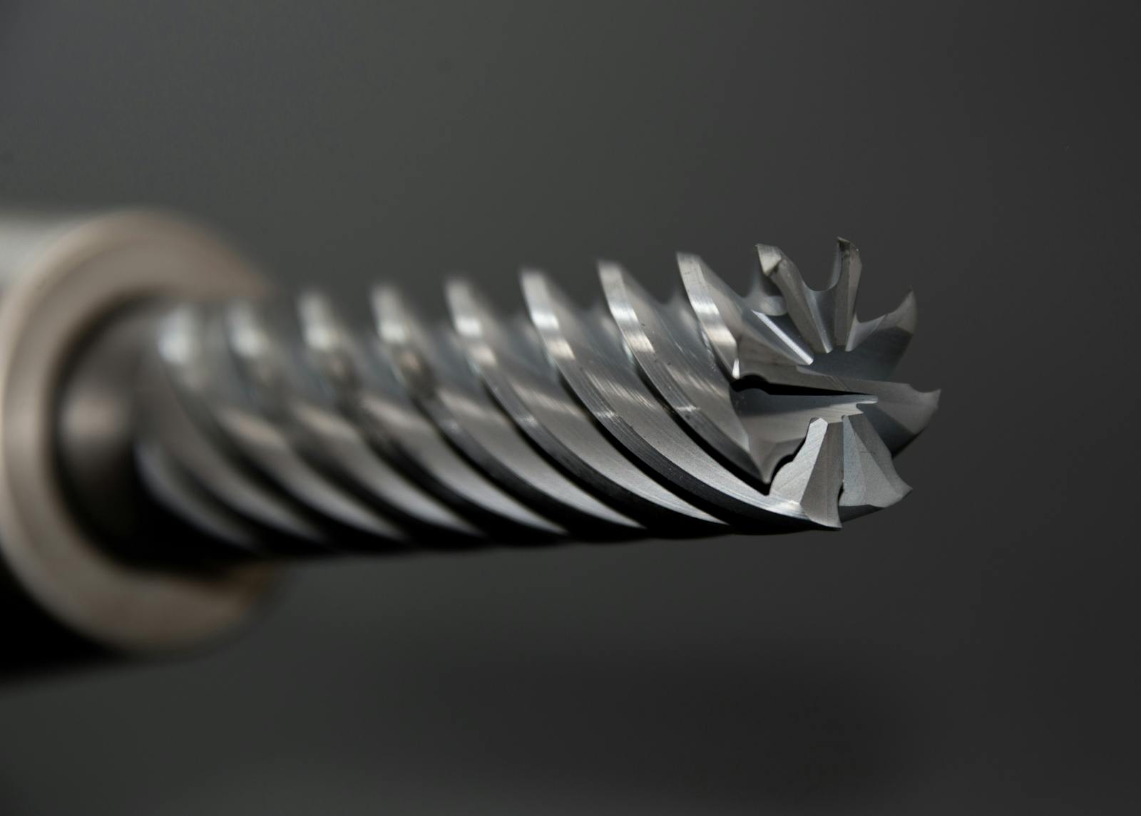 Macro shot of a drilling head showcasing precision metal engineering details.